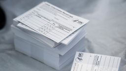 A stack of COVID-19 Vaccination Record Cards from the CDC. 
