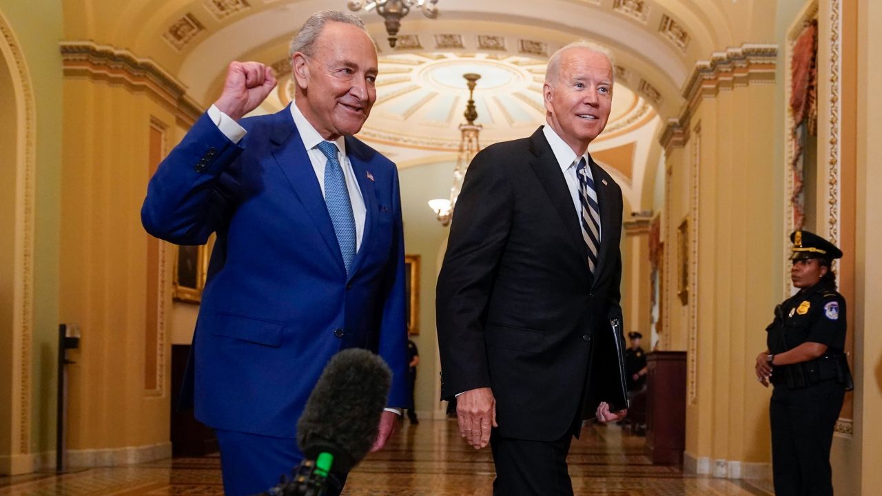 President Joe Biden walks with Senate Majority Leader Chuck Schumer, D-N.Y., at the Capitol in Washington, Wednesday, July 14, 2021, as he arrives to discuss the latest progress on his infrastructure agenda. 