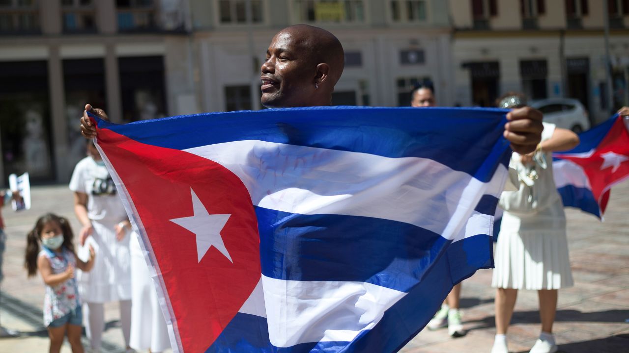A man seen holding a Cuban flag as he takes part in a protest this week in support of the Cuban population at Plaza de la Constitution square in Malaga, Spain.