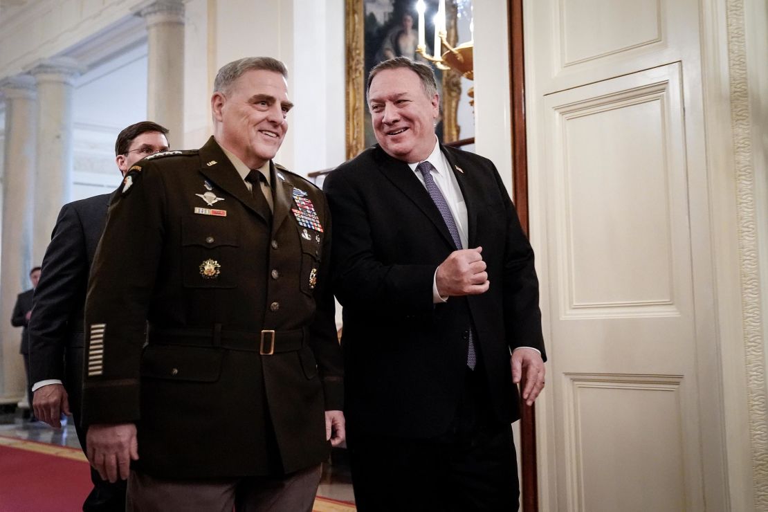 Chairman of the Joint Chiefs of Staff Gen. Mark Milley and US Secretary of State Mike Pompeo arrive for a Presidential Medal of Freedom ceremony for retired four-star Army general Jack Keane in the East Room of the White House March 10, 2020 in Washington, DC. 