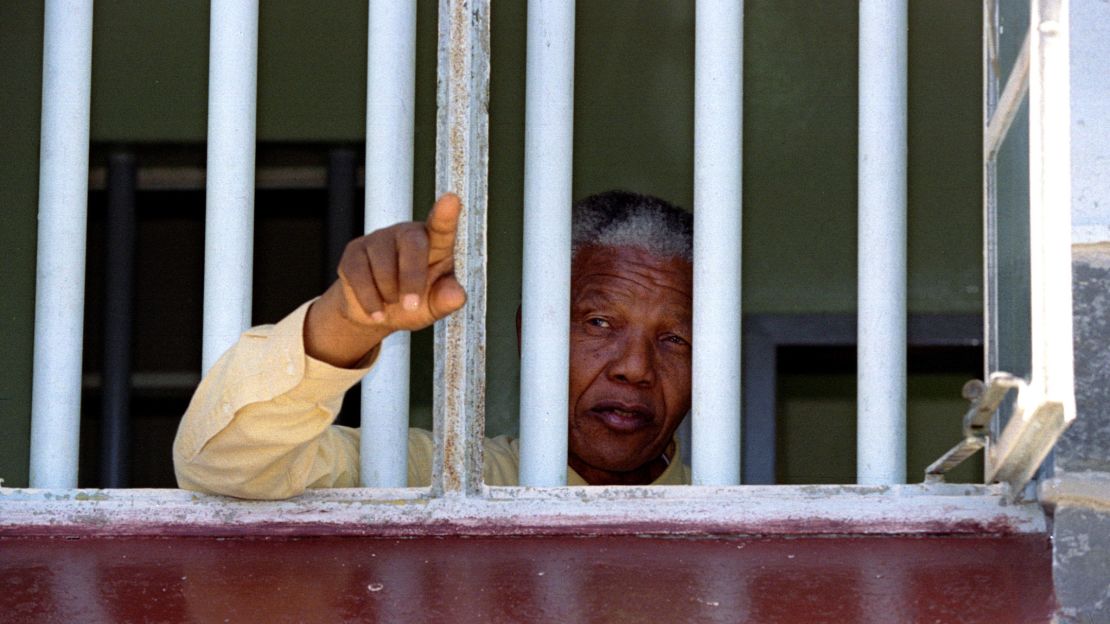  Nelson Mandela stares out of the window of the prison cell he occupied on Robben Island for much of his 27 year prison sentence. It was at Robben that Mandela learned the language and ways of his White jailers. 