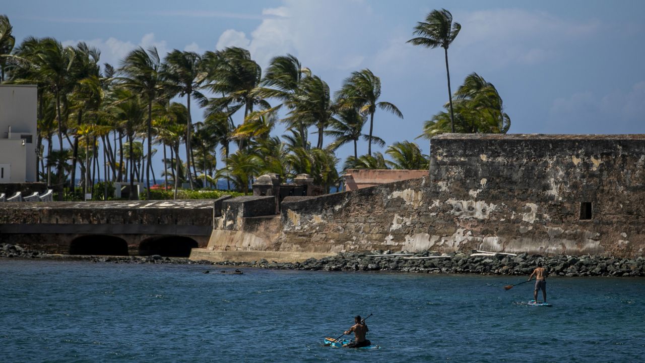 Paddleboarders enjoy themselves near a beach in the Condado neighborhood of San Juan.