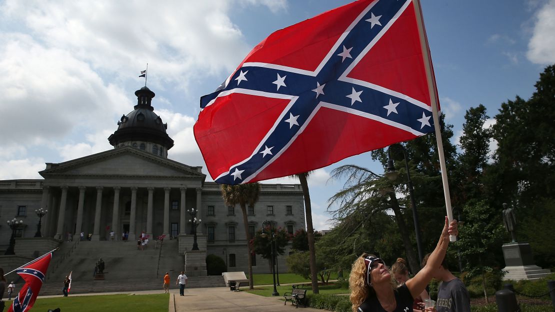 Barbie Byrd, of Columbia, South Carolina joins a group of demonstrators on the grounds of the South Carolina State House calling for the Confederate flag to remain on the State House grounds. 