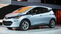 The Chevrolet Bolt EV drives onstage during a press conference at the 2017 North American International Auto Show in Detroit, Michigan, January 9, 2017. 