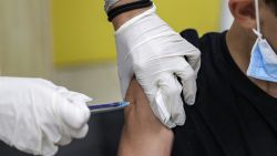 A boy receives a dose of the Pfizer/BioNTech Covid-19 vaccine at the Clalit Healthcare Services in the Israeli city of Holon near Tel Aviv on June 21, 2021, as Israel begins coronavirus vaccination campaign for 12 to 15-year-olds. - Israel is now urging more 12- to 15-year-olds to be vaccinated, citing new outbreaks attributed to the more infectious Delta variant. (Photo by JACK GUEZ / AFP) (Photo by JACK GUEZ/AFP via Getty Images)