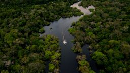 Aerial view showing a boat speeding on the Jurura river in the municipality of Carauari, in the heart of the Brazilian Amazon Forest, on March 15, 2020. - Many young people in the heart of the Amazon rainforest choose their community over the city. (Photo by Florence GOISNARD / AFP) (Photo by FLORENCE GOISNARD/AFP via Getty Images)