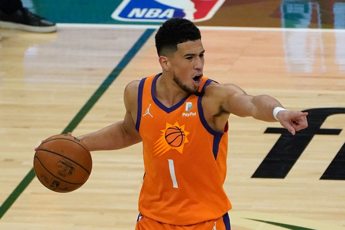Phoenix Suns guard Devin Booker (1) directs teammates during the first half against the Milwaukee Bucks in Game 4.