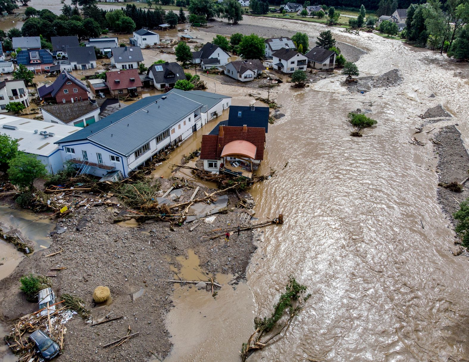 Houses are damaged by flooding in Insul, Germany, on Thursday.