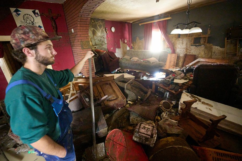 A man surveys what remains of his house in Schuld.