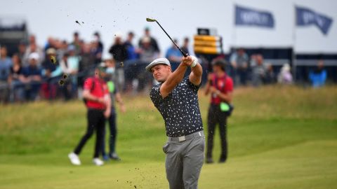 Big-hitting Bryson DeChambeau hits an approach shot from the fairway at the 149th Open Championship in 2021.