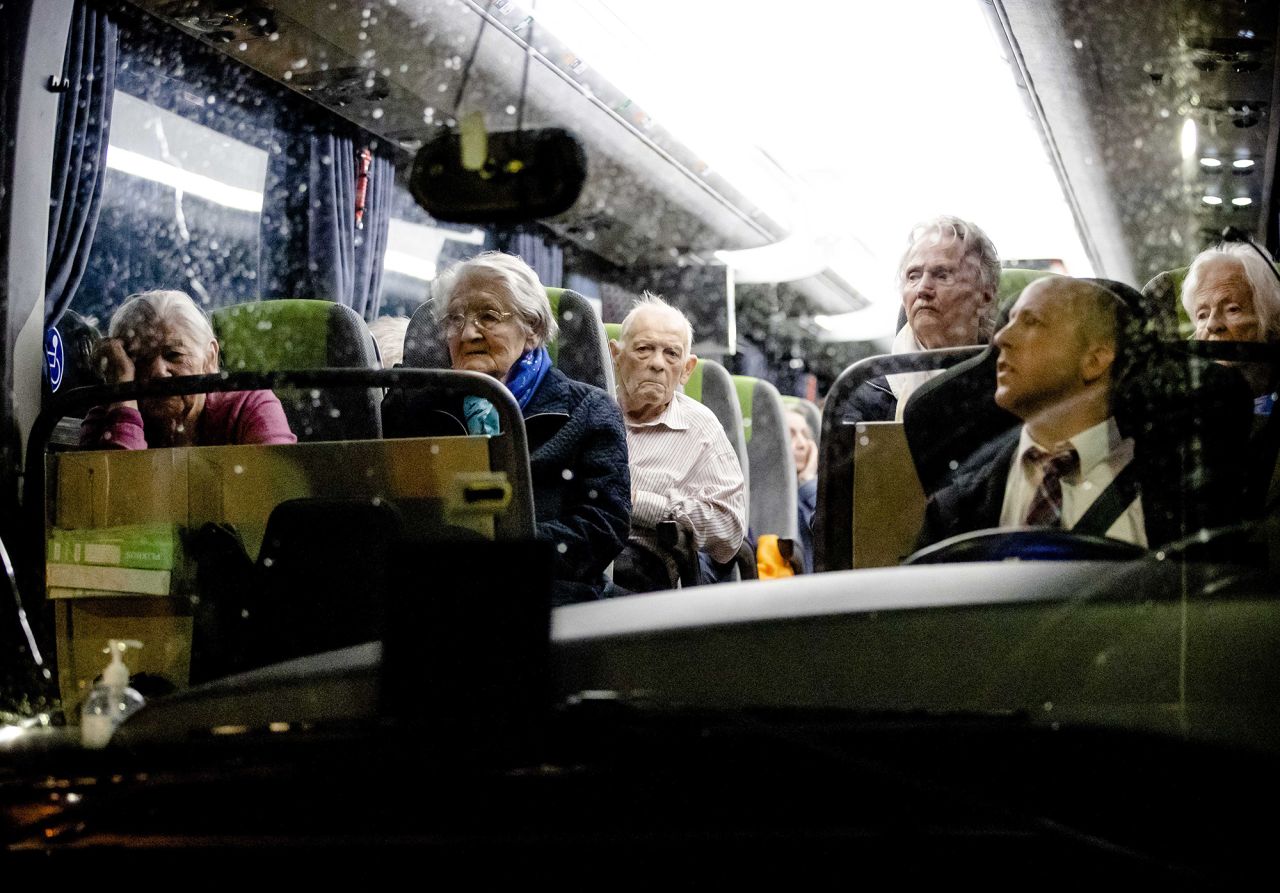 Evacuees ride a bus in Valkenburg aan de Geul, Netherlands.