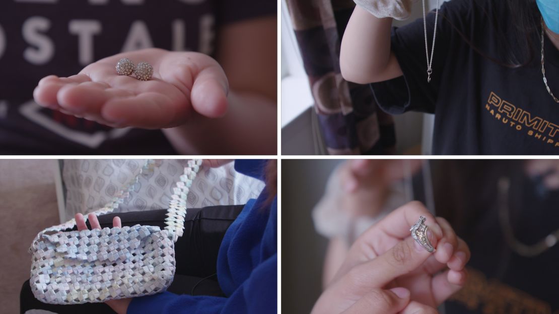 The daughters with four of their most cherished possessions -- items from their mother. Clockwise from top right: Casandra holds a lettered necklace, Abril holds a quinceañera ring, Julieta holds a paper purse made by their mom, and Montserrat holds a set of earrings.