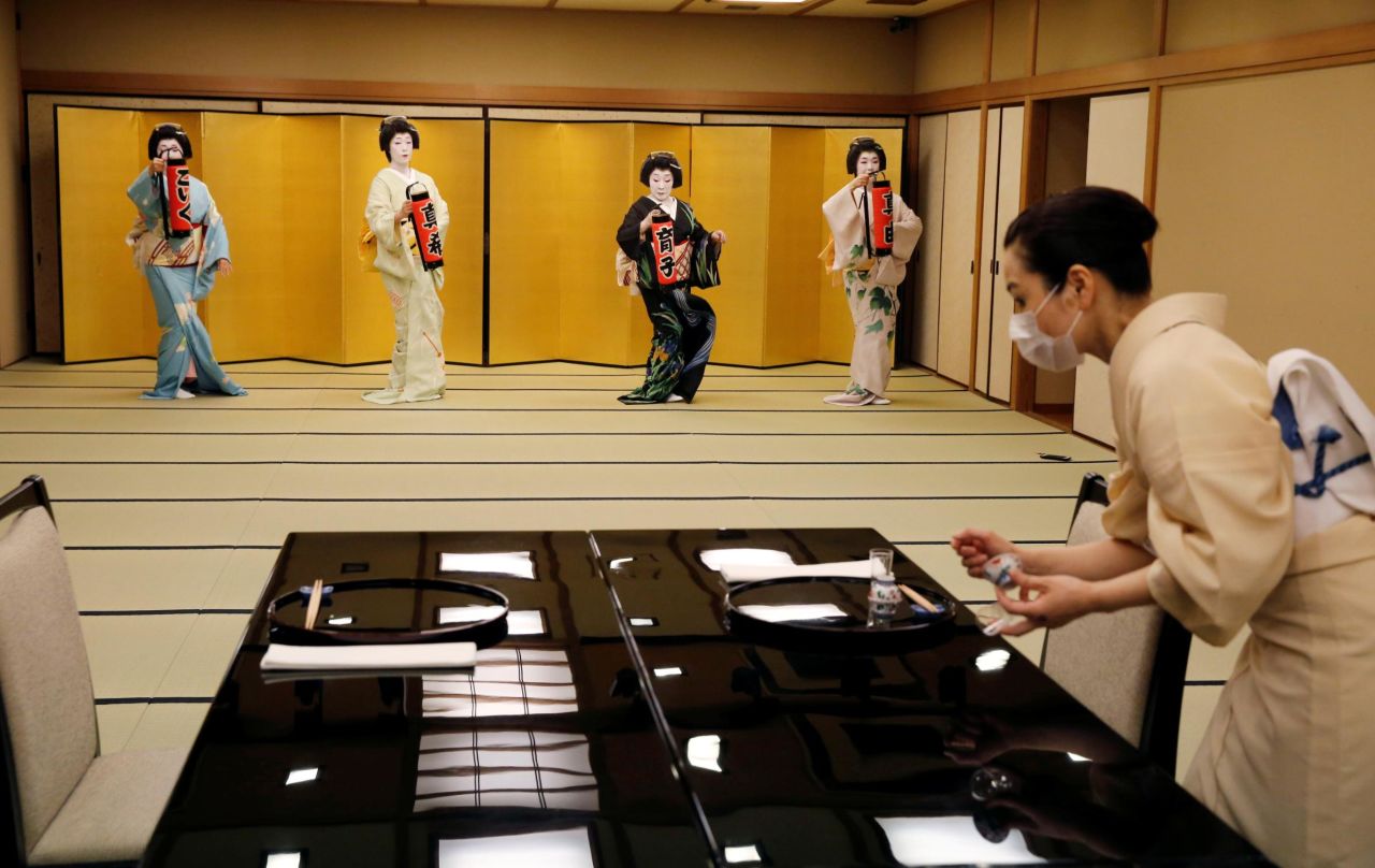 Koiku, Maki, Ikuko and Mayu, who are geisha, perform a dance routine during the coronavirus pandemic.