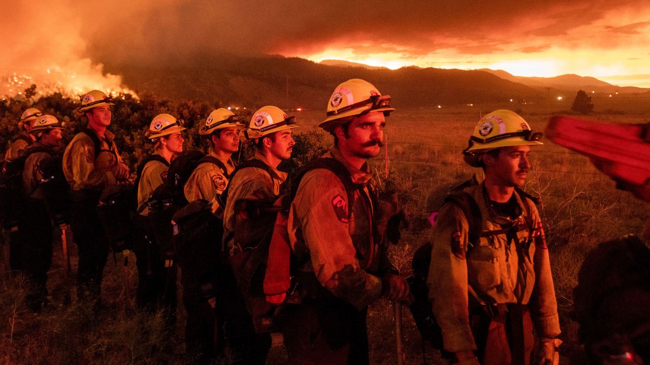 Firefighters from Cal Fire's Placerville station monitor the Sugar Fire, part of the Beckwourth Complex Fire, in Doyle, California, on Friday, July 9.