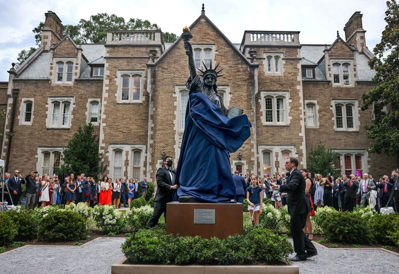 A miniature model of the Statue of Liberty is unveiled at the French ambassador's home in Washington, DC, on Wednesday, July 14. <a href="https://www.cnn.com/2021/07/14/politics/statue-of-liberty-little-sister-washington-dc/index.html" target="_blank">The "little sister"</a> is an exact replica of the original but one-sixteenth of its size.