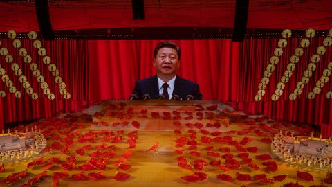 Chinese President Xi Jinping appears on a large screen during a dance performance at a mass gala marking the 100th anniversary of the Communist Party in Beijing.