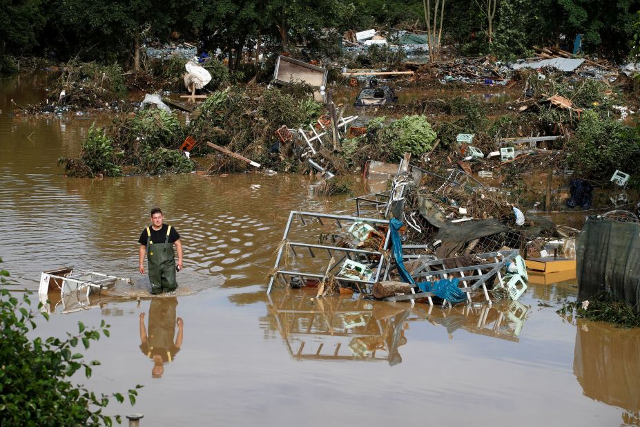 A man walks through a flooded part of Bad Neuenahr-Ahrweiler, Germany, on Thursday.