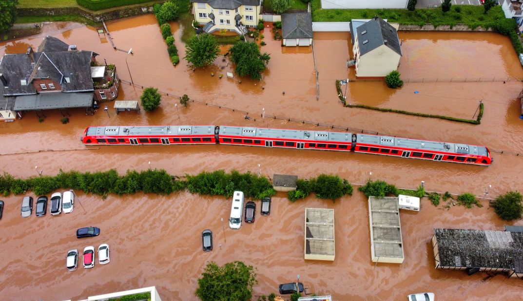 A regional train sits in floodwaters at the local station in Kordel, Germany.