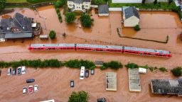 A regional train sits in the flood waters at the local station in Kordel, Germany, Thursday July 15, 2021 after it was flooded by the high waters of the Kyll river. (Sebastian Schmitt/dpa via AP)