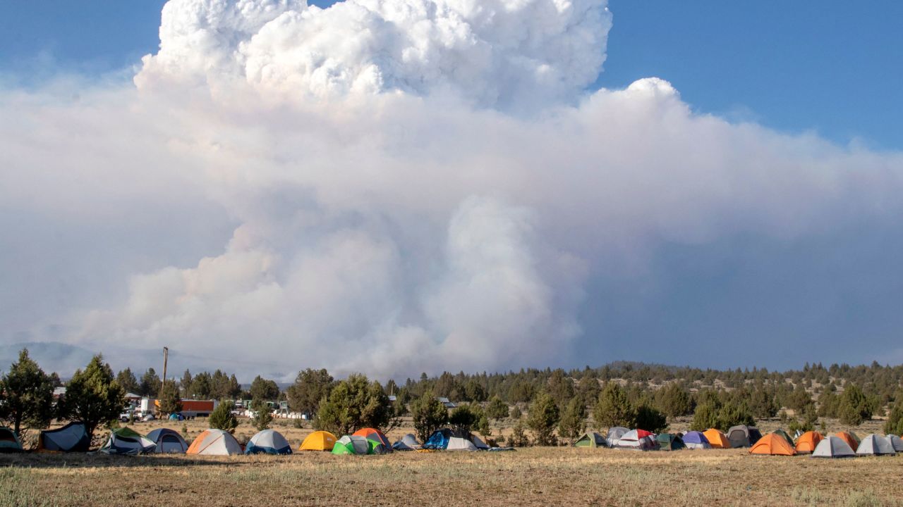 A cloud caused by the Bootleg Fire drifts into the air north of the Bootleg Fire forward operating base in Bly, Oregon, on July 15, 2021.