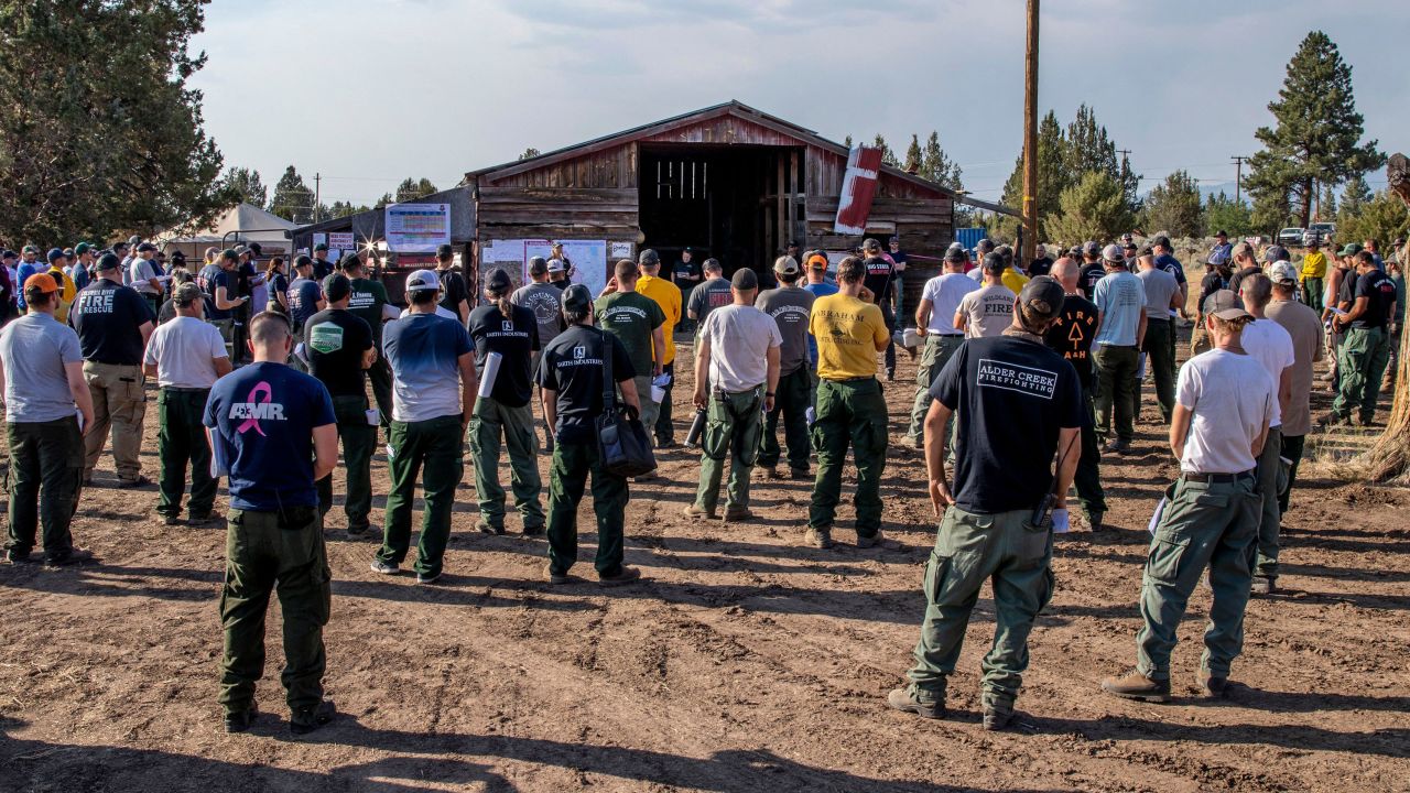 The Bootleg Fire night crew listens to a briefing at their operating base in Bly, Oregon, on July 15, 2021.