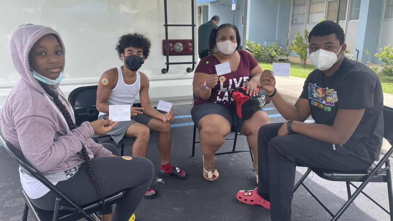 Danielle Chin (second from right) brought three of her children (from left), Dhazima, Marqes and Trayveon, to receive their Covid-19 vaccinations at a mobile clinic in Miami on Wednesday, July 14.
