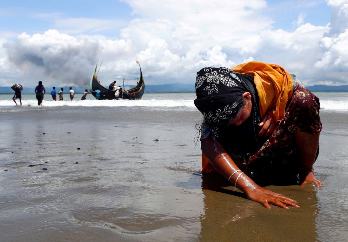 Danish Siddiqui won a Pulitzer Prize for his work on the Rohingya refugee crisis. This photo shows a Rohingya woman touching the shore after crossing the Bangladesh-Myanmar border.