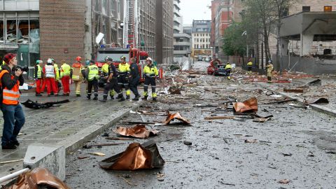 Firefighters work at the site of the explosion near government buildings in the Norwegian capital, Oslo, on July 22, 2011.