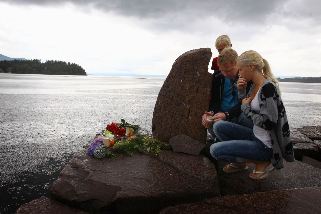 Members of the public pay their respects near Utoya Island on July 24, 2011 in Norway.