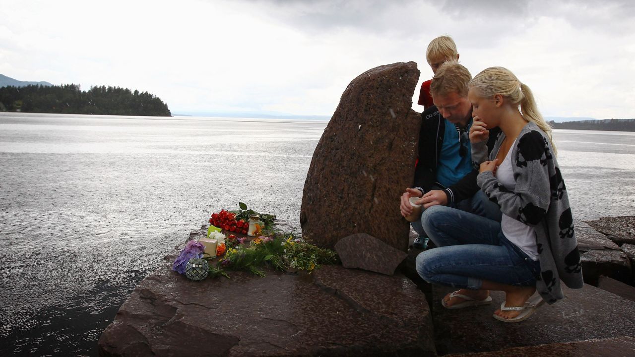 Members of the public pay their respects near Utoya Island on July 24, 2011 in Norway.