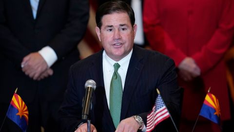 Arizona Gov. Doug Ducey's education adviser sent a letter to two school districts stating a mandatory quarantine practice is contrary to state law.