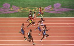 Linford Christie of Great Britain wins his heat in the first round of the men's 100m at the 1996 Centennial Games in in Atlantia, Georgia. Great care was taken in Atlanta to protect athletes and fans from the heat. 