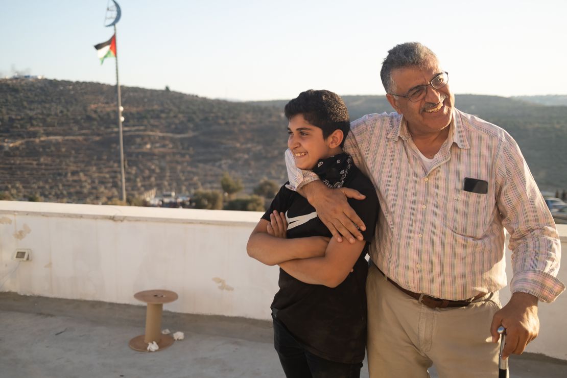 Nishat Al Aqtash on his rooftop overlooking Beita, West Bank.