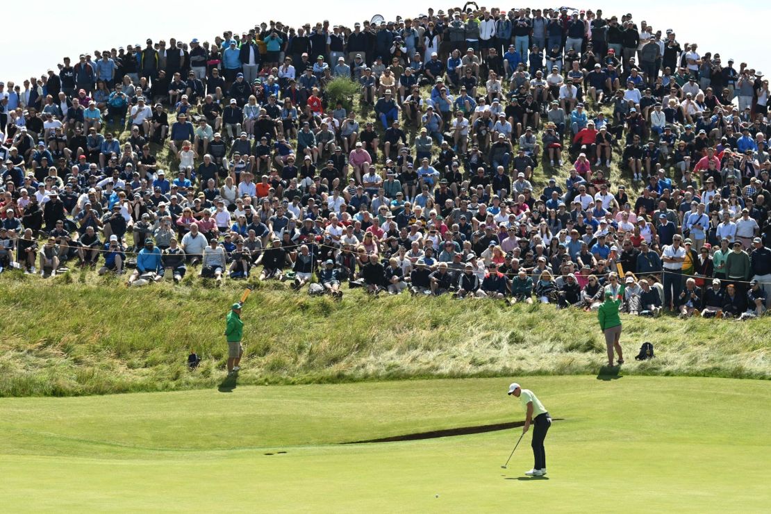 McIlroy putts on the 6th green during his second round of The  Open.
