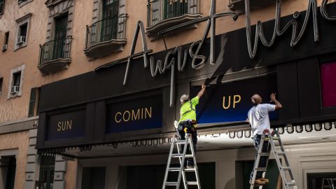 Workers replace signs at the August Wilson Theatre before the opening of "Pass Over" in New York City on Thursday, June 29, 2021.