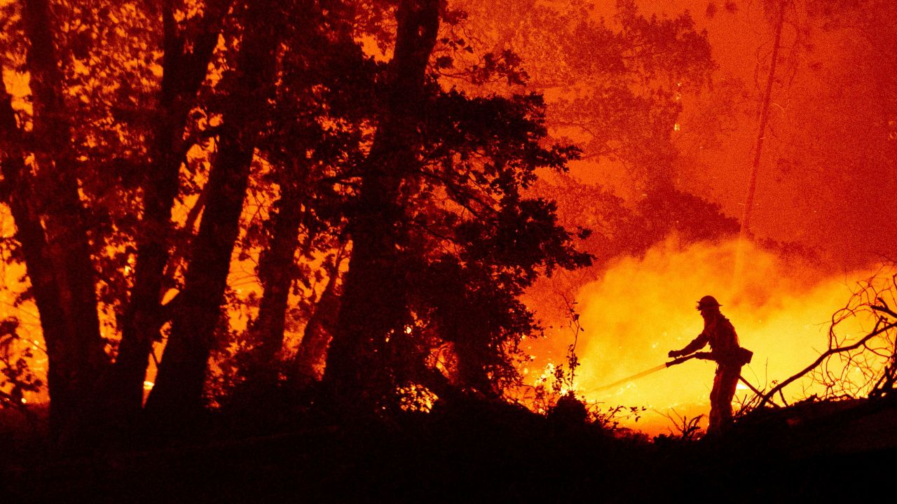 In this photo from September 7, 2020, a firefighter fights the Creek Fire in Madera County, California. 