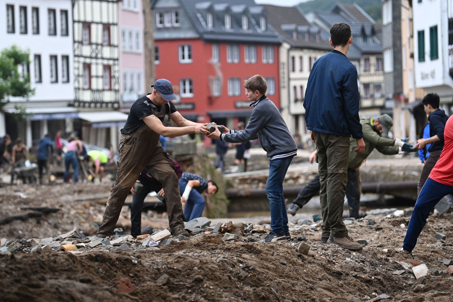 People collect debris in Bad Muenstereifel, Germany.