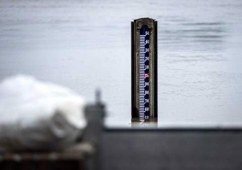 A water level gauge shows rising waters in Arcen, Netherlands, on Saturday. Dutch officials ordered the evacuation of 10,000 people in the municipality of Venlo, as the Meuse was rising there faster than expected.