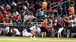 WASHINGTON, DC - JULY 17:  Fans run for cover after what was believed to be shots were heard during a baseball game between the San Diego Padres the Washington Nationals at Nationals Park on July 17, 2021 in Washington, DC.  (Photo by Mitchell Layton/Getty Images)