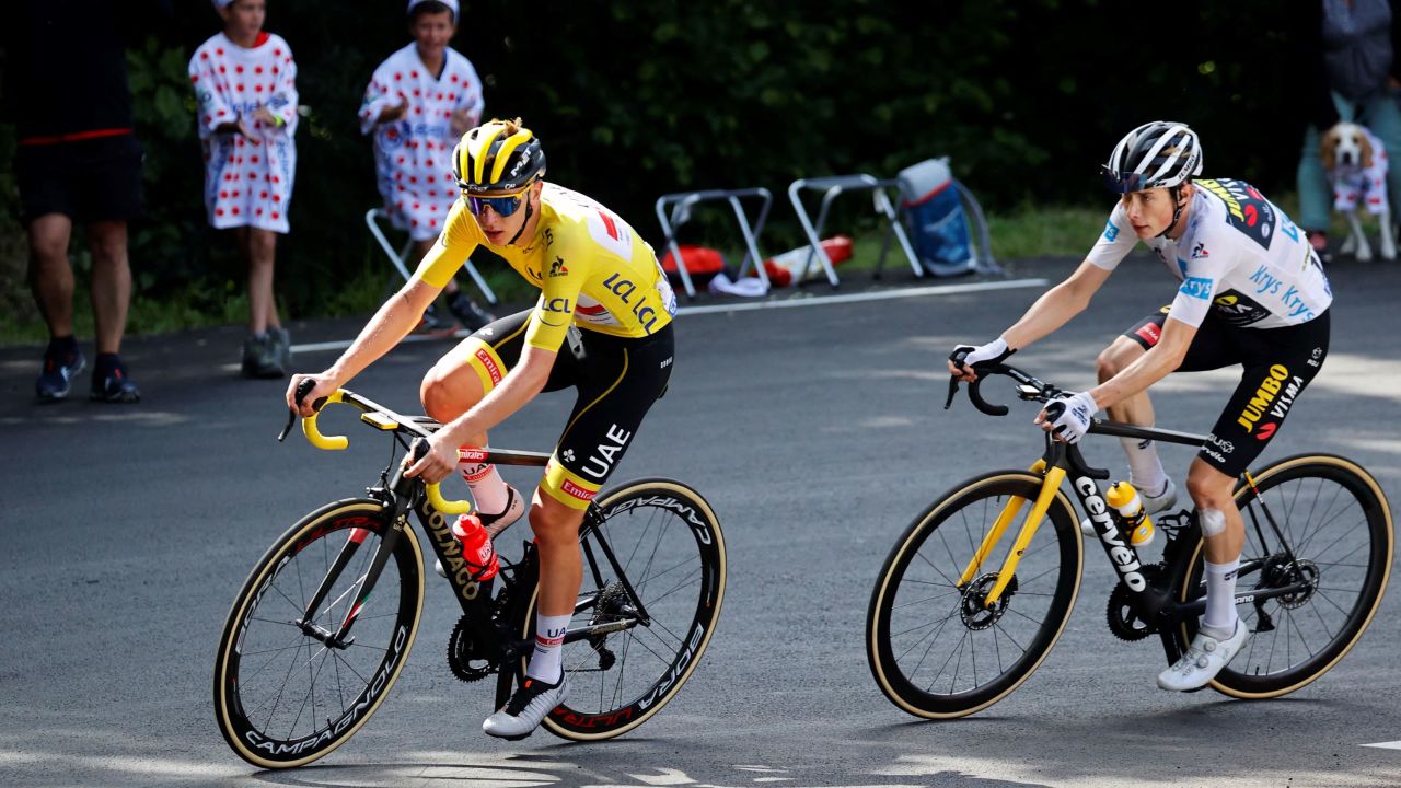 Pogacar rides ahead of Vingegaard during the 18th stage between Pau and Luz Ardiden, on July 15, 2021.