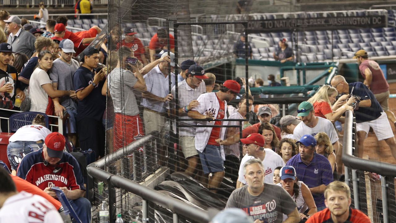 Fans leave their seats after a shooting outside Nationals Park during an MLB game in Washington, DC, on Saturday.