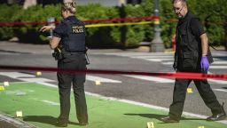 Police investigate an overnight shooting Saturday, July 17, 2021 in Portland, Ore. Police said one person died and at least six people were injured in an early morning shooting Saturday in Portland, Oregon. (Mark Graves/Oregonian/AP)