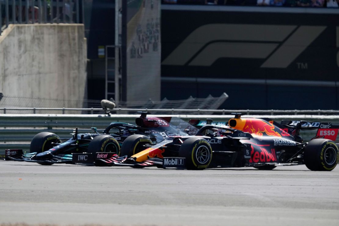 Hamilton and Max Verstappen take a curve side-by-side at the start of the British Grand Prix. 