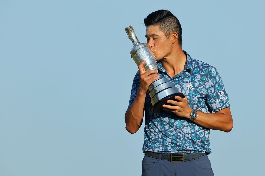 Morikawa kisses the Claret Jug on the 18th hole after winning The 149th Open at Royal St George's Golf Club.