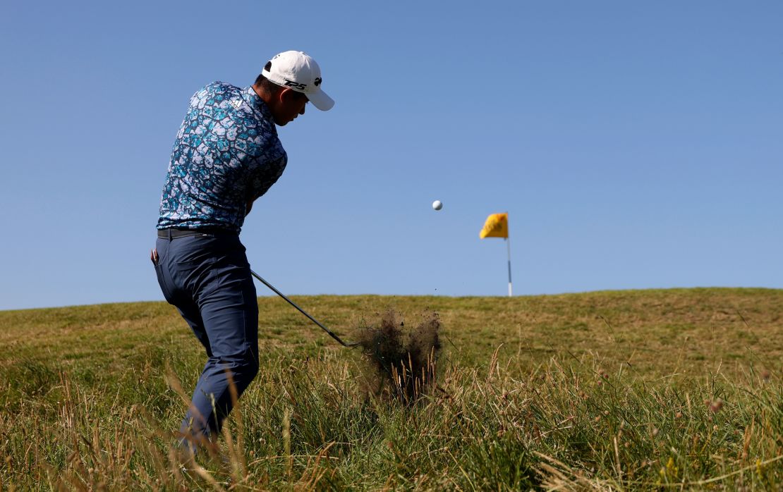 Morikawa plays a shot on the 10th hole from the rough during the final round of the Open.
