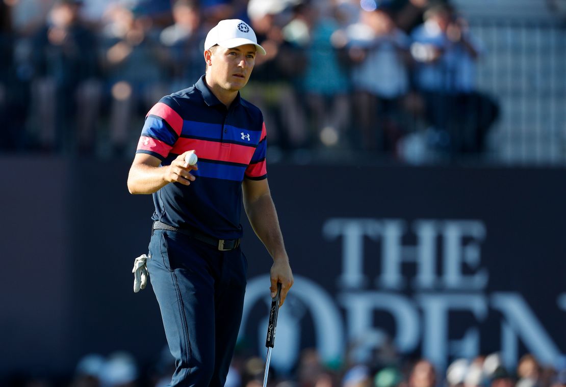 Spieth reacts on the green of the 18th hole on day four of the Open.