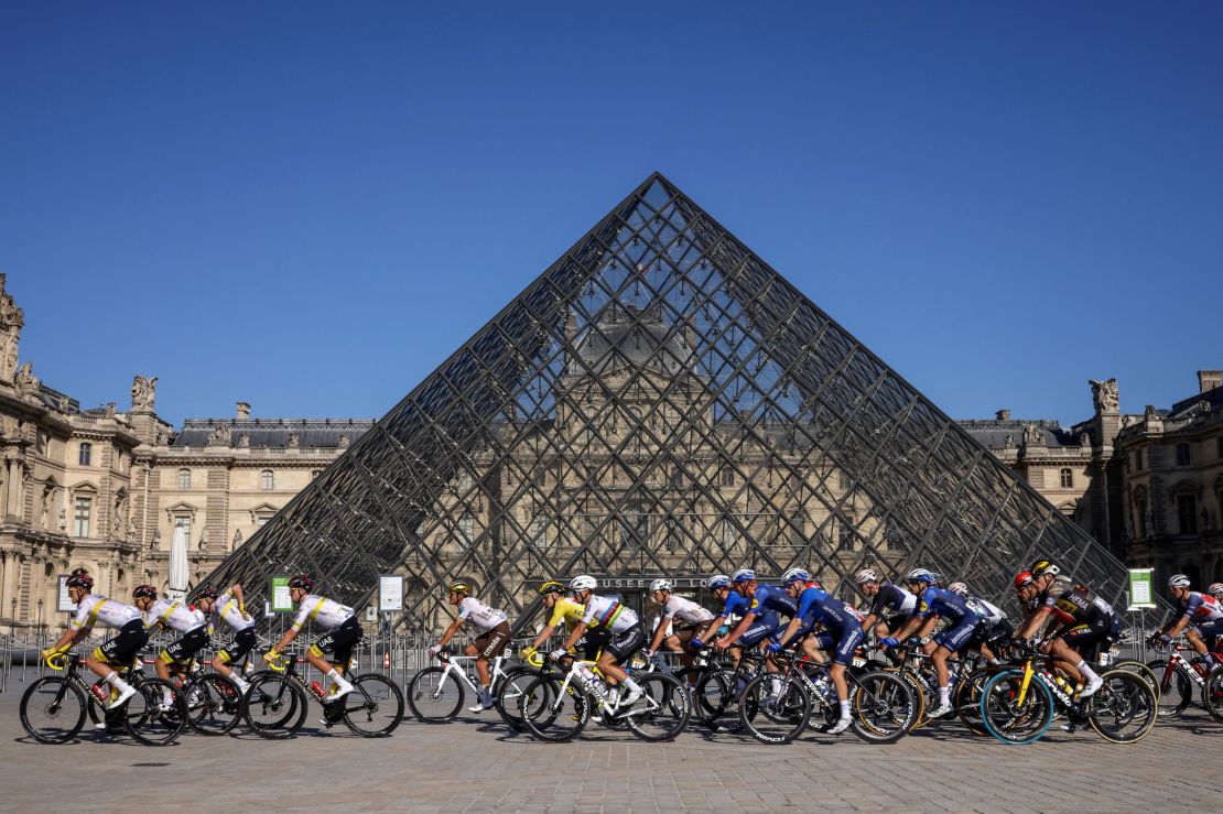 Wearing the yellow jersey, Pogaca rides in front of The Louvre Museum on Sunday, July 18.