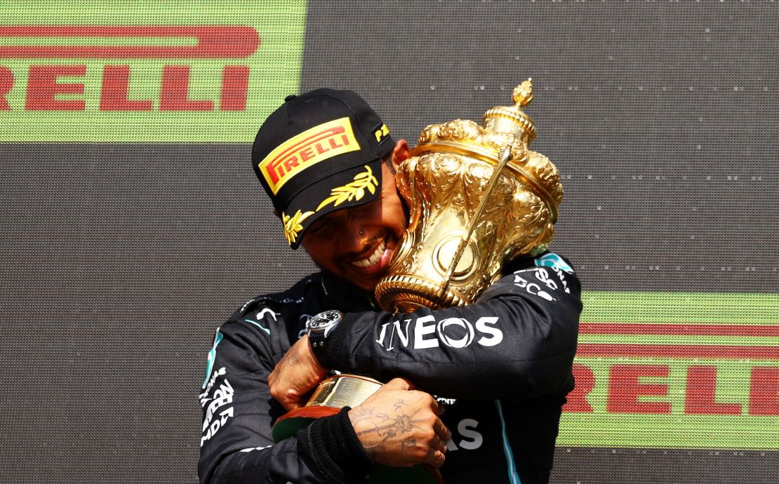 Lewis Hamilton celebrates on the podium at Silverstone.