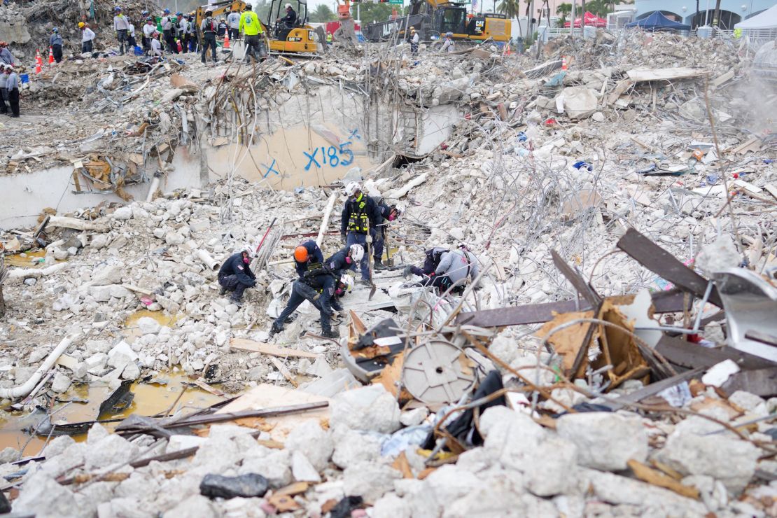 Task force members working at the residential building collapse site in Miami-Dade County, Florida are seen in this photo released by the Miami-Dade Fire Rescue on July 10.