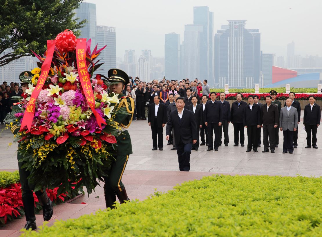 Xi Jinping, general secretary of the Communist Party of China (CPC) Central Committee and chairman of the CPC Central Military Commission (CMC), lays a wreath to the statue of late Chinese leader Deng Xiaoping in Shenzhen on December 11, 2012.